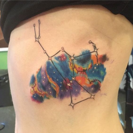 Orion and watercolor nebula tattoo by Em Becker