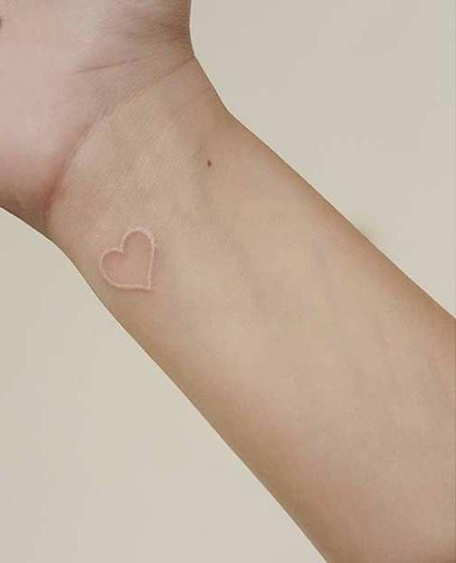 Small White Heart Tattoo On Wrist