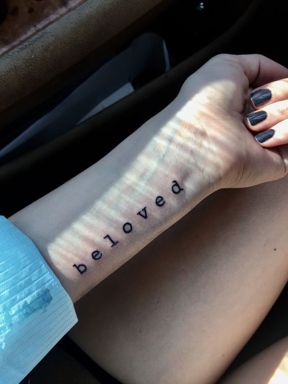 Beloved tattoo on the arm
