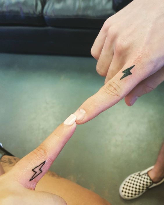 Brother and sister matching finger tattoos