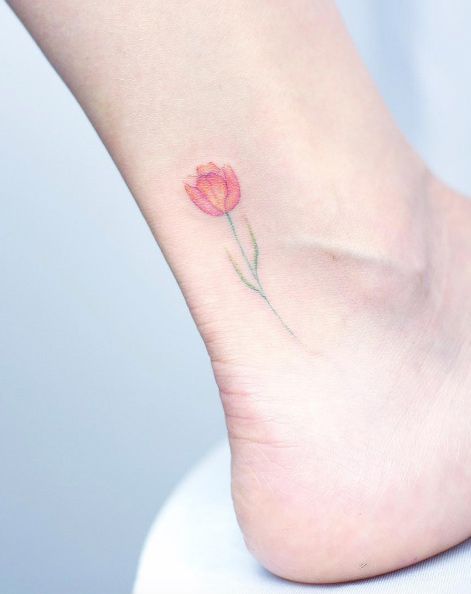 Dimensional tulip tattoo on ankle by Mini Lau