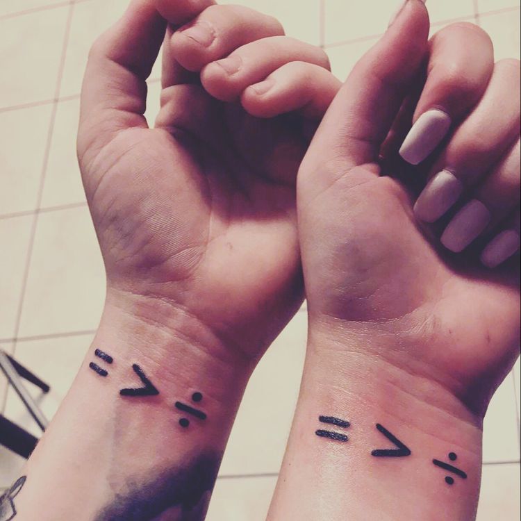 Equal is greater than division LGBT wrist tattoo idea