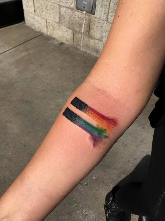 Equality sign tattoo on the inner arm