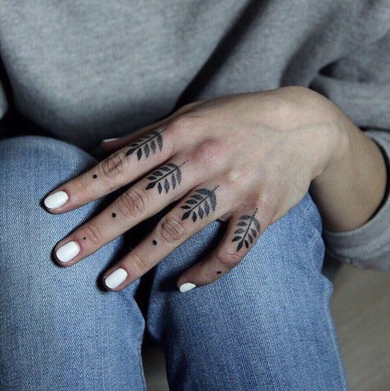 Fern leaves tattoo on the fingers