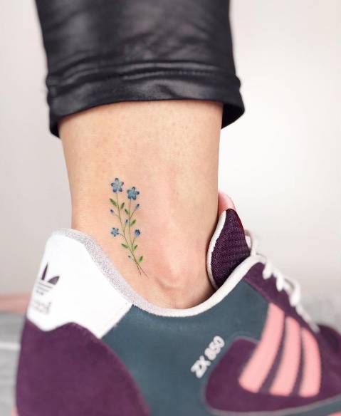 Floral ankle tattoo by Jakub Nowicz