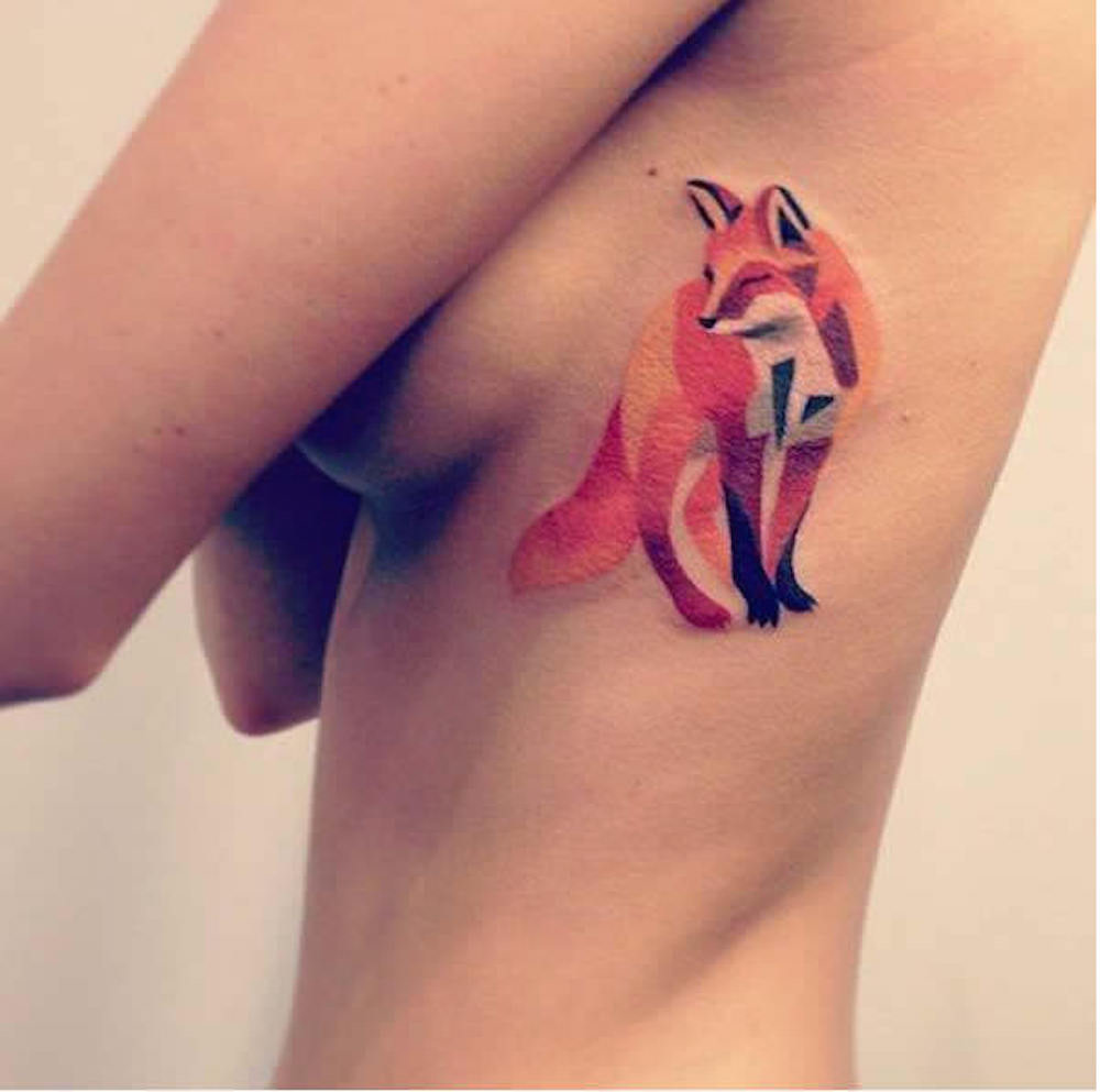 Geometric fox tattoo on the ribcage