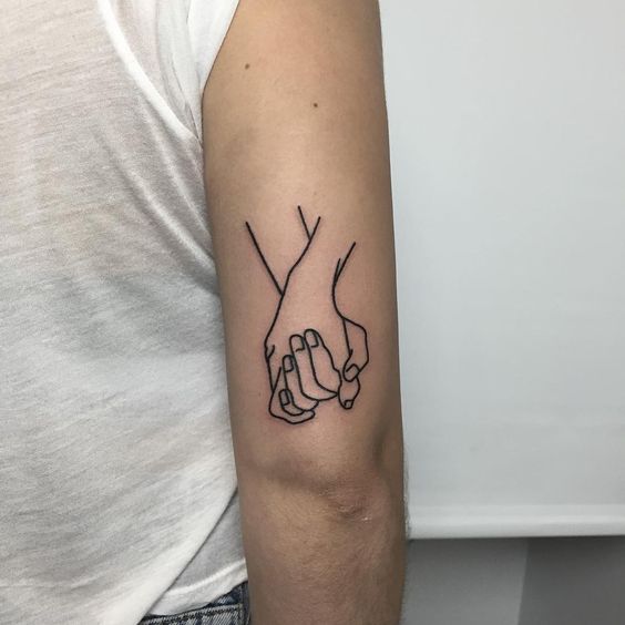 Holding hands LGBT tattoo