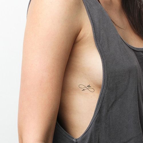 Infinity arrow tattoo on the ribcage