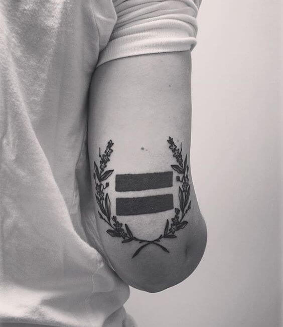 LGBT commemorative tattoo on the tricep above the elbow.