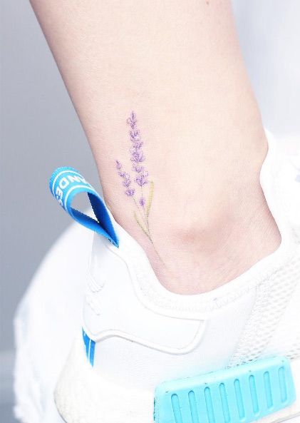 Lavender tattoo on an ankle by Mini Lau