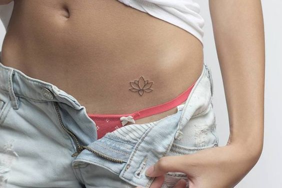 Lotus flower tattoo on the belly