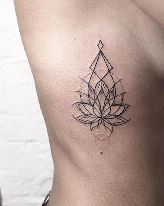 Lotus flower tattoo on the right ribcage