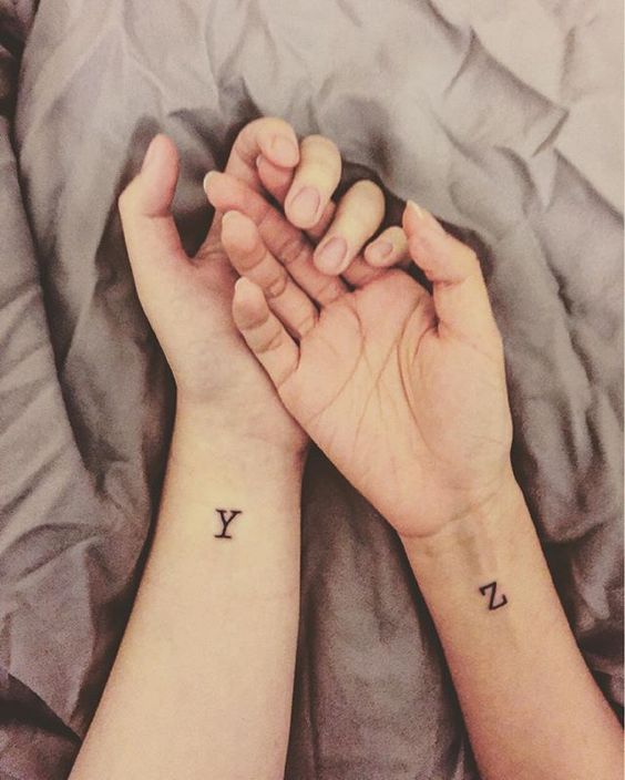 Matching initial tattoos for couple