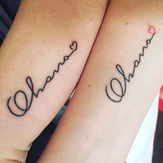 Matching sisters ohana tattoo with a tiny heart