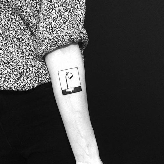 Minimal lamp tattoo on the arm