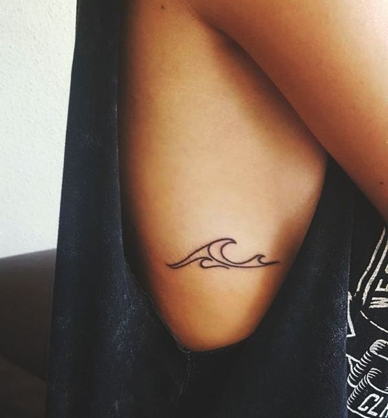 Minimalist wave tattoo on the side