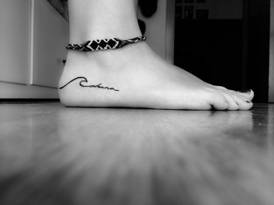 Ohana feet tattoo with a small wave