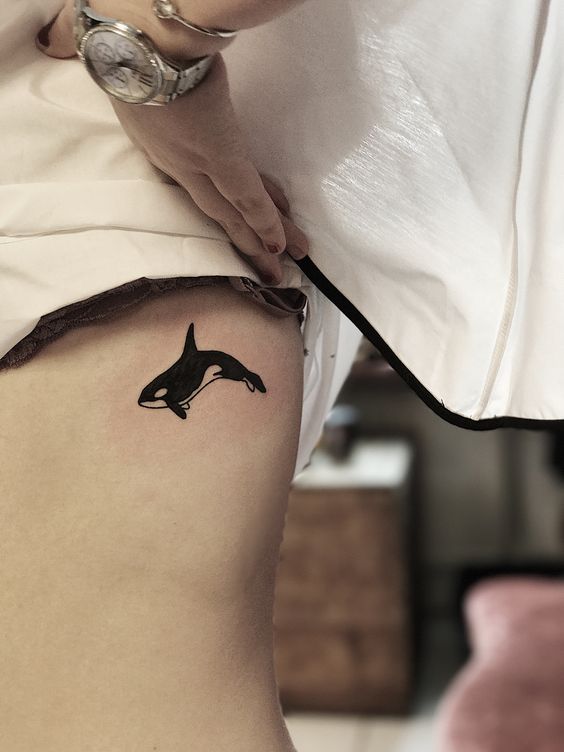 Orca tattoo on the rib
