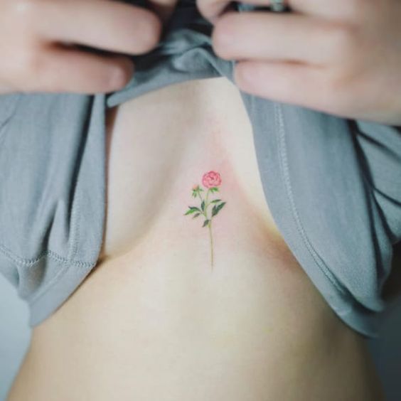 Red flower tattoo on the chest