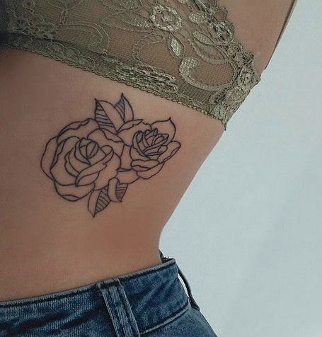 Ribcage outline rose tattoo