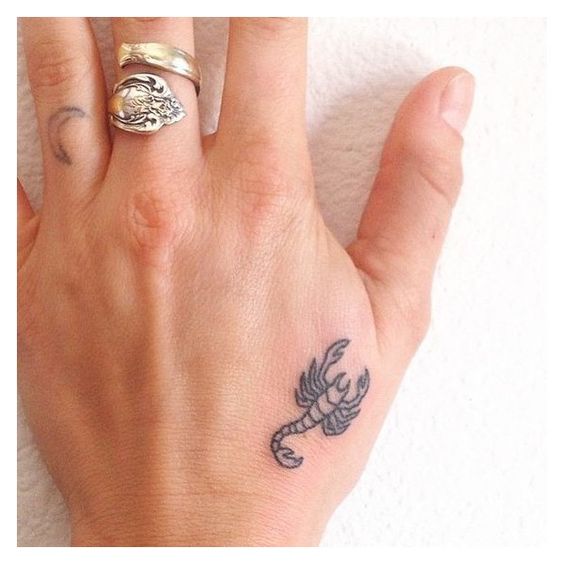 Scorpio tattoo on the hand