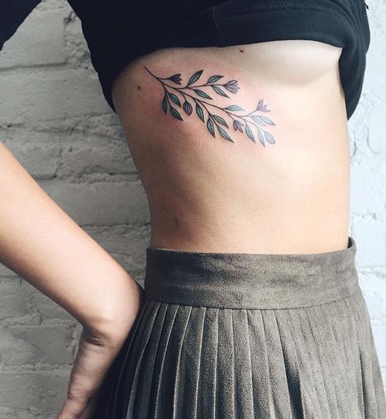 Simple and beautiful flower tattoo on the side