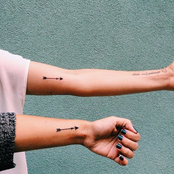 Sisters matching arrow tattoo idea