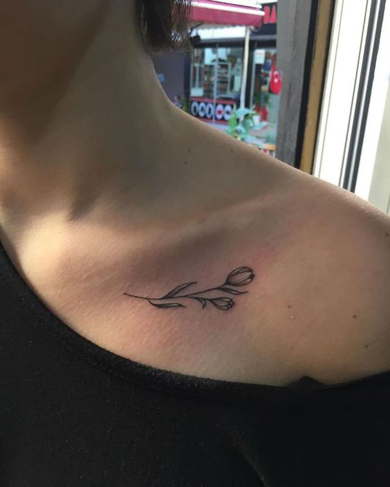 Small Tulip Tattoo On A Collarbone