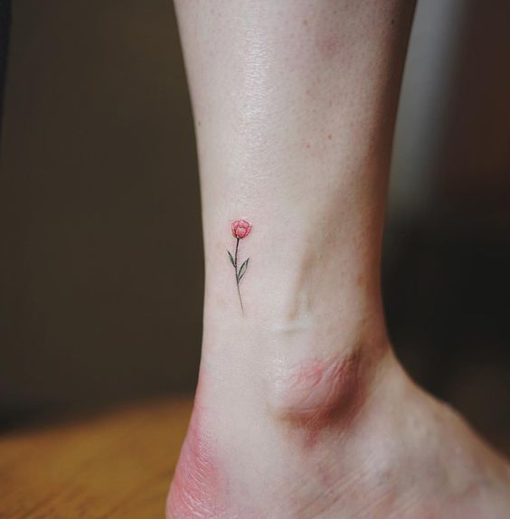 Small red rose tattoo