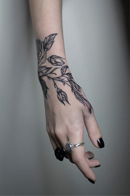 Subtle flower tattoo on arm