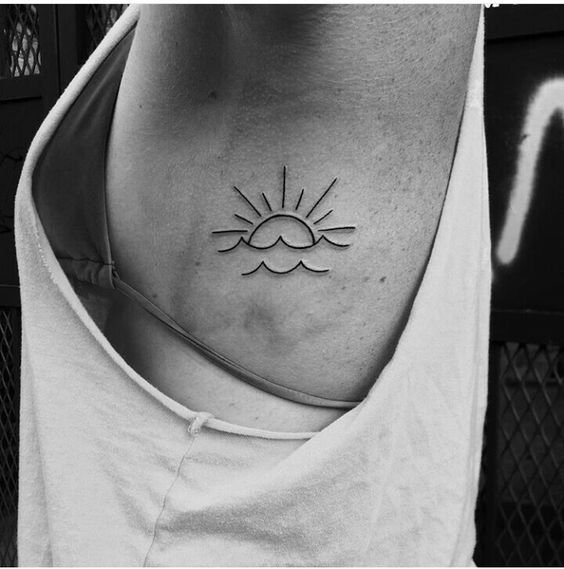 Sun and sea tattoo on the side