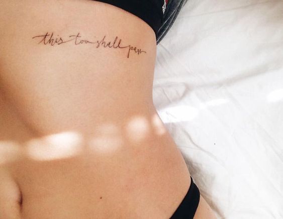 This too shall pass tattoo on the rib
