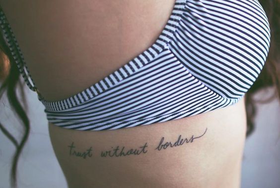 Trust without borders tattoo on the rib