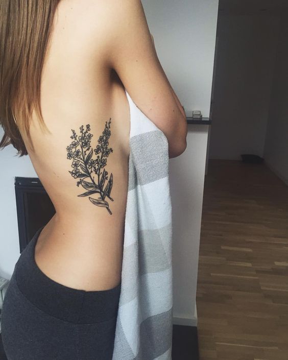 Wildflower bouqet tattoo on the rib