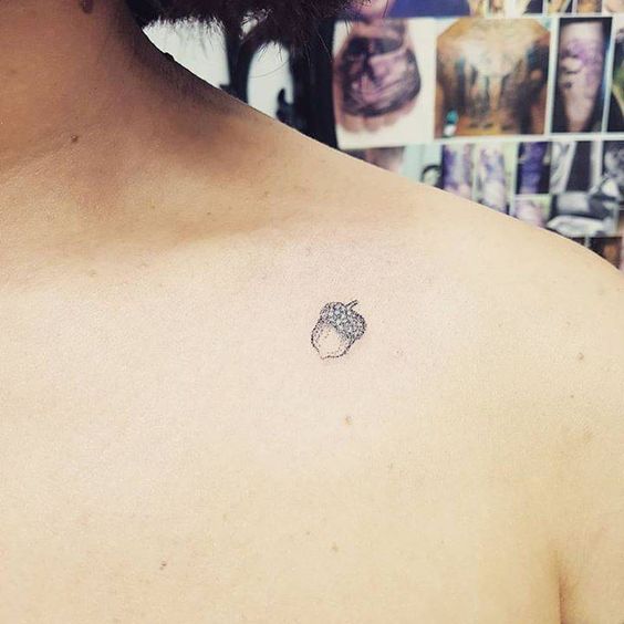 Acorn tattoo on the clavicle