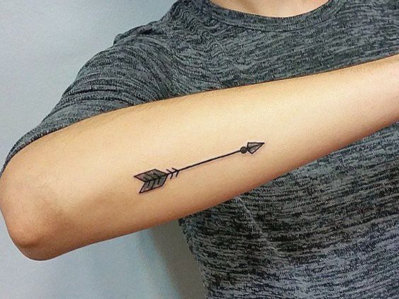 Another small arrow tattoo on the forearm