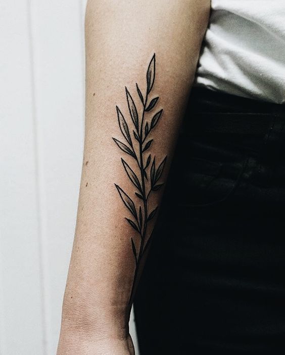 Beautiful black wildflower tattoo on the arm