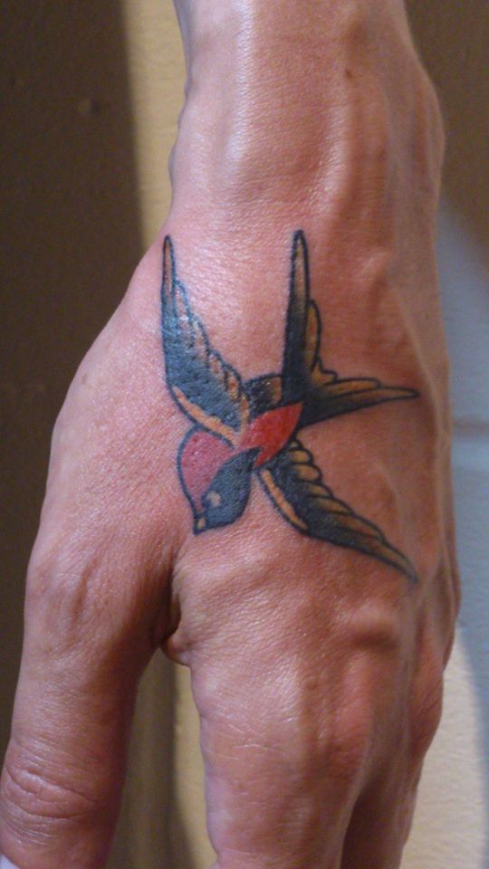 Bird tattoo on the hand