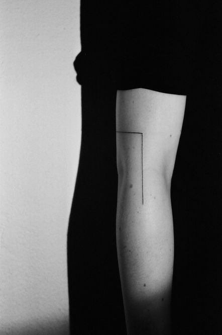 Black line tattoo on the arm