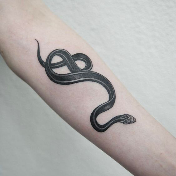 Black work snake tattoo on arm by Sang Bleuzurich