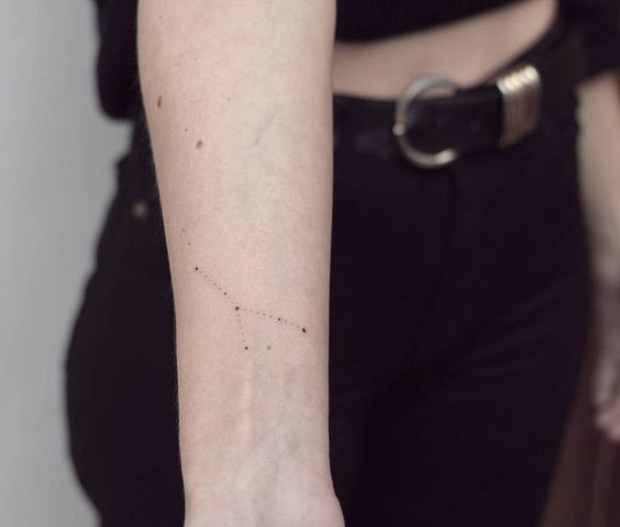 Cancer constellation tattoo on the arm