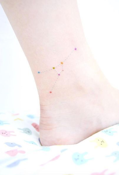 Colorful Cancer constellation on the ankle by tattooist Banul