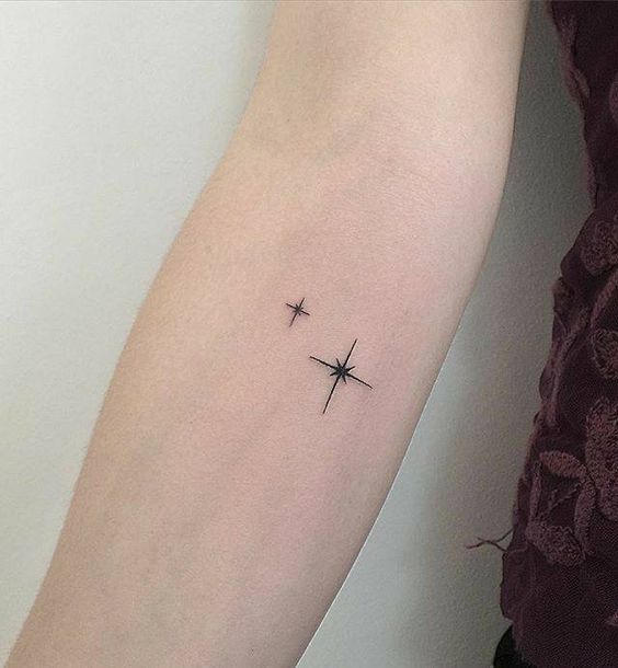 Distant stars tattoo on the arm