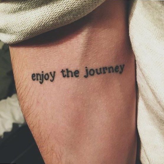 Enjoy the journey quote tattoo on the arm