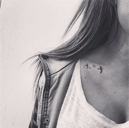Flock of birds tattoo on the clavicle
