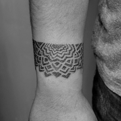 Half mandala tattoo on the wrist