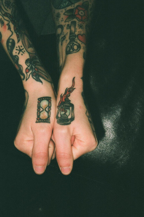 Hourglass and oil lampa tattoo on the hands