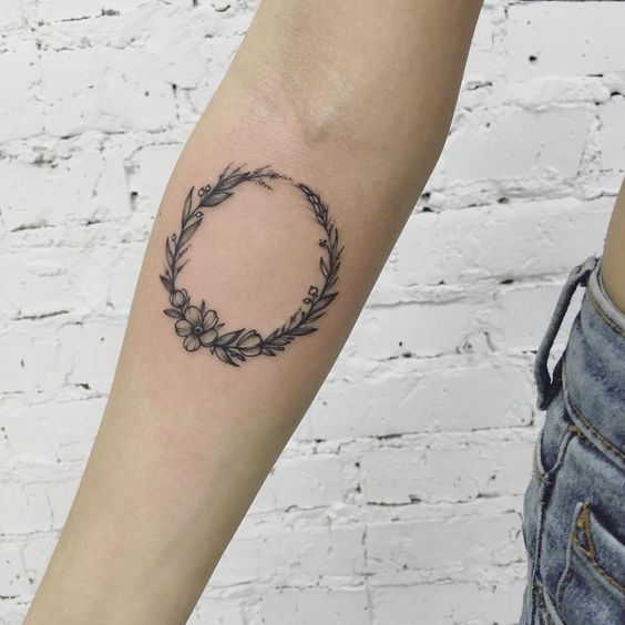 Laurel wreath tattoo on the inner arm
