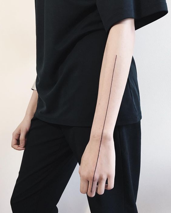 Long and simple arm tattoo