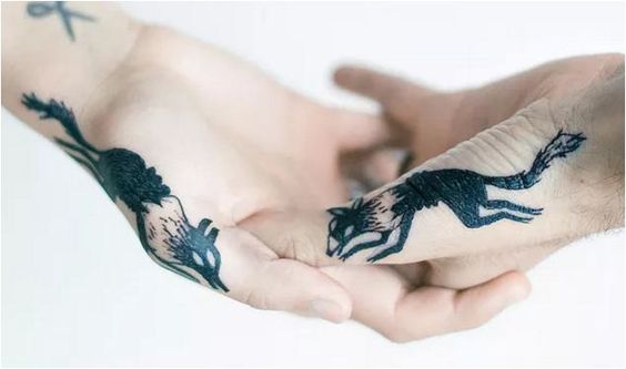 Matching hand tattoos
